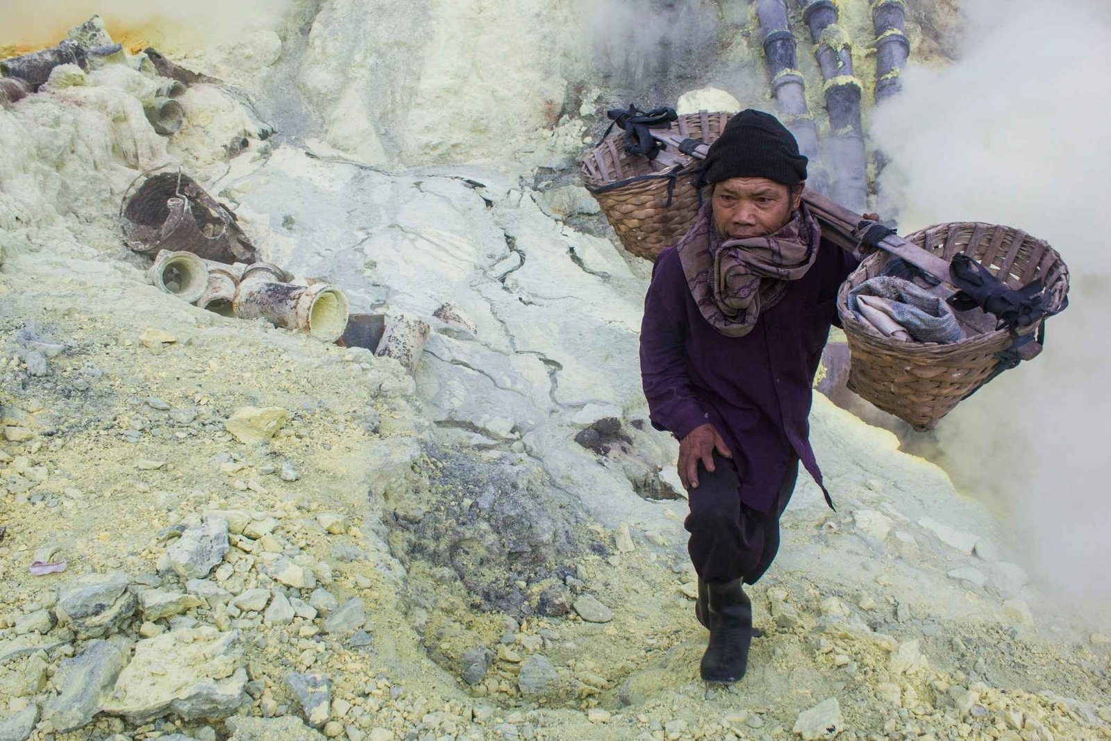 Traditional sulfur miners working at Ijen Crater East Java