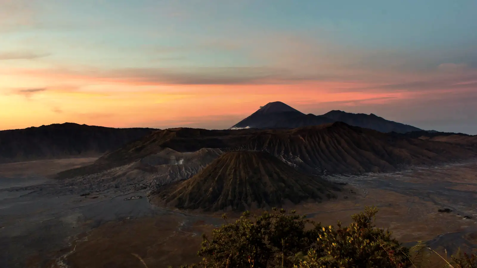 Mount Bromo Sunrise Adventure Panoramic view of Mount Bromo crater and volcanic landscape at sunrise