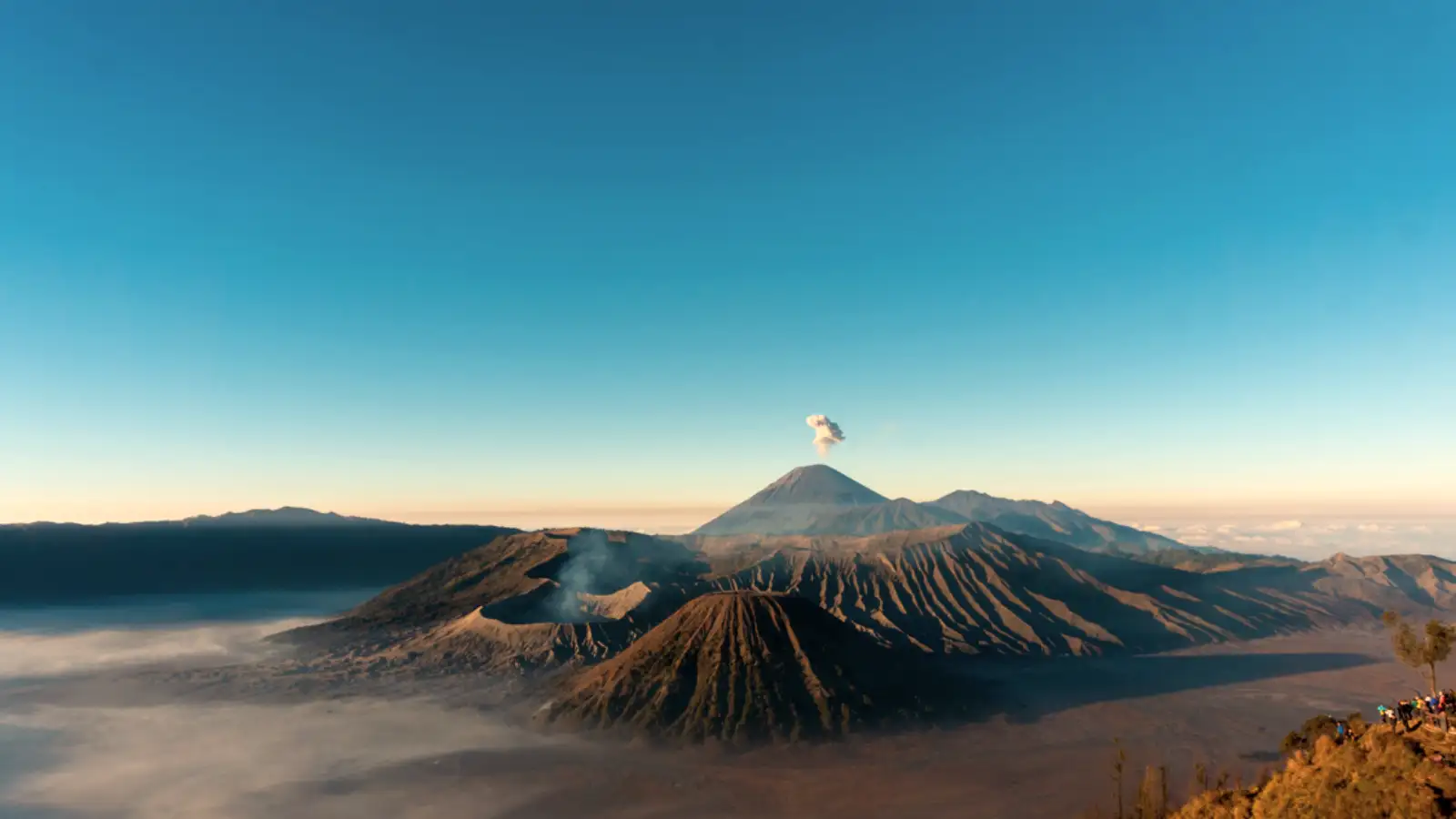 Mount Bromo Sunrise Experience Golden sunrise over the mist-covered Mount Bromo volcanic caldera