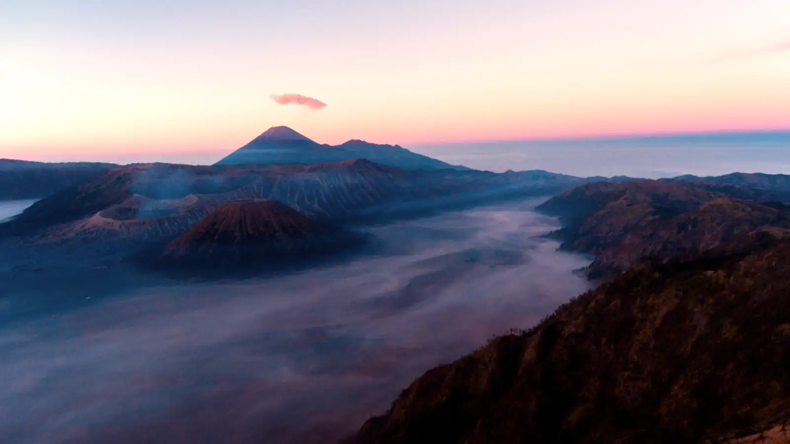 Mount Bromo Sunrise View Sunrise over Mount Bromo crater and volcanic peaks