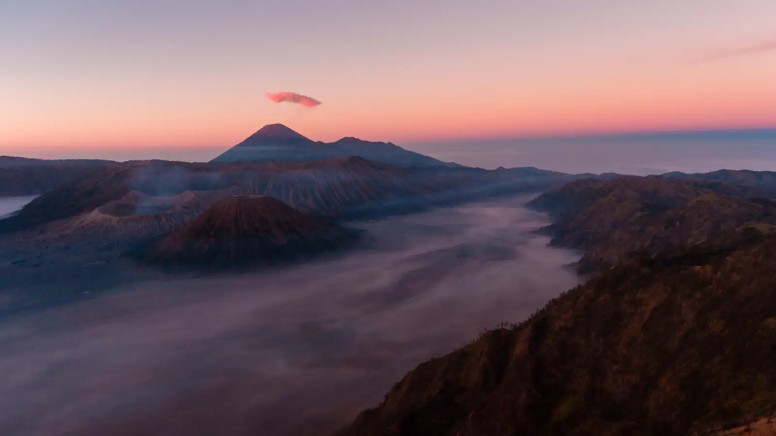 Aerial view of the turquoise acid lake at Ijen Crater